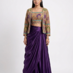 Make a sophisticated style statement with this royal purple Draped Skirt and Jacket set by